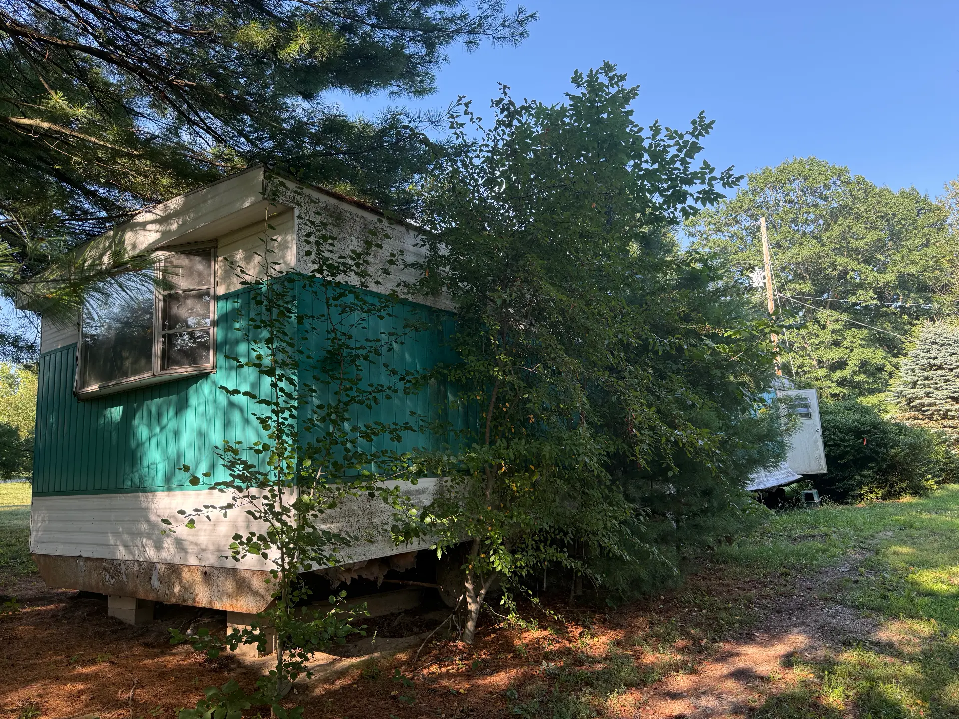 Before: old mobile home torn down and hauled away, lot left clean